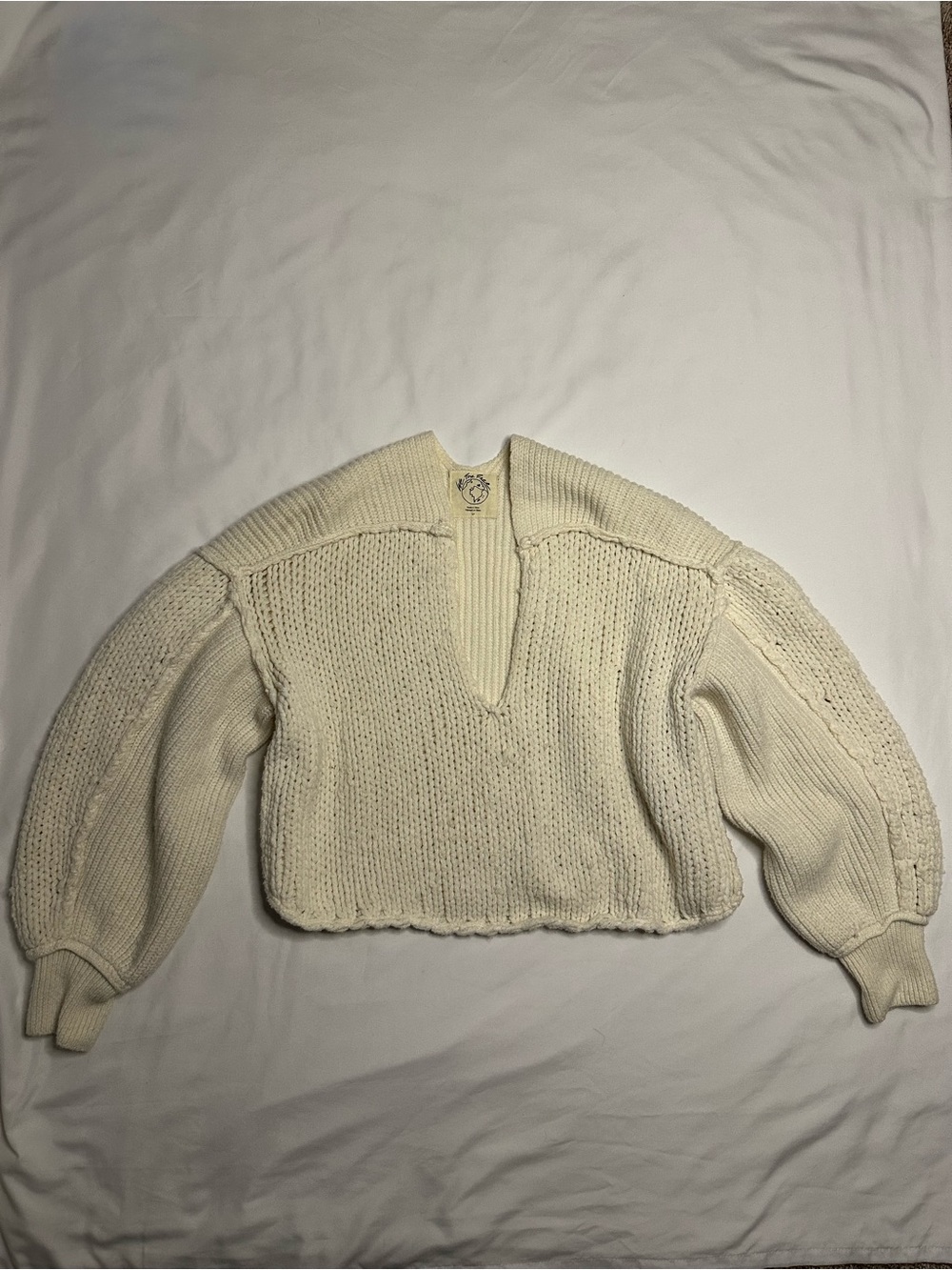 Free People cream v-neck knit sweater